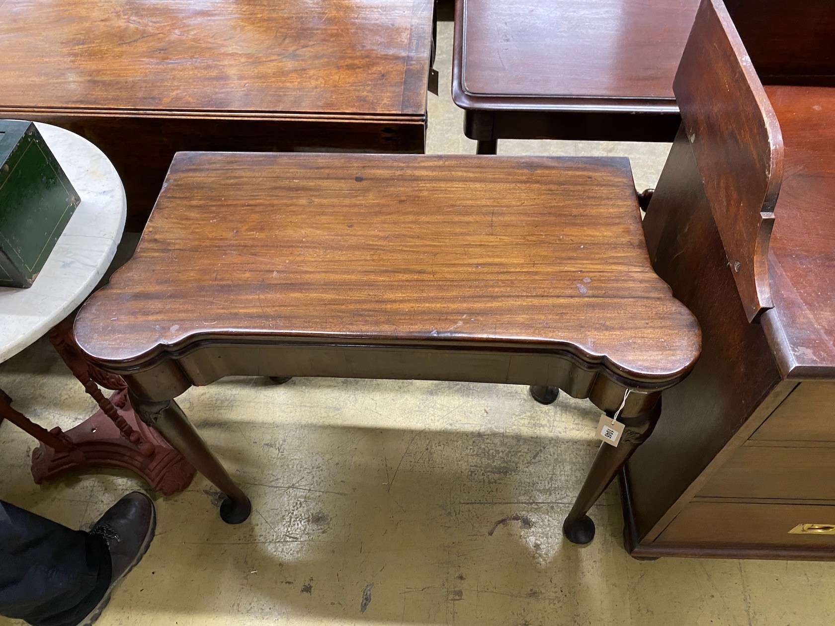 An 18th century mahogany folding tea table, width 83cm, depth 40cm, height 72cm